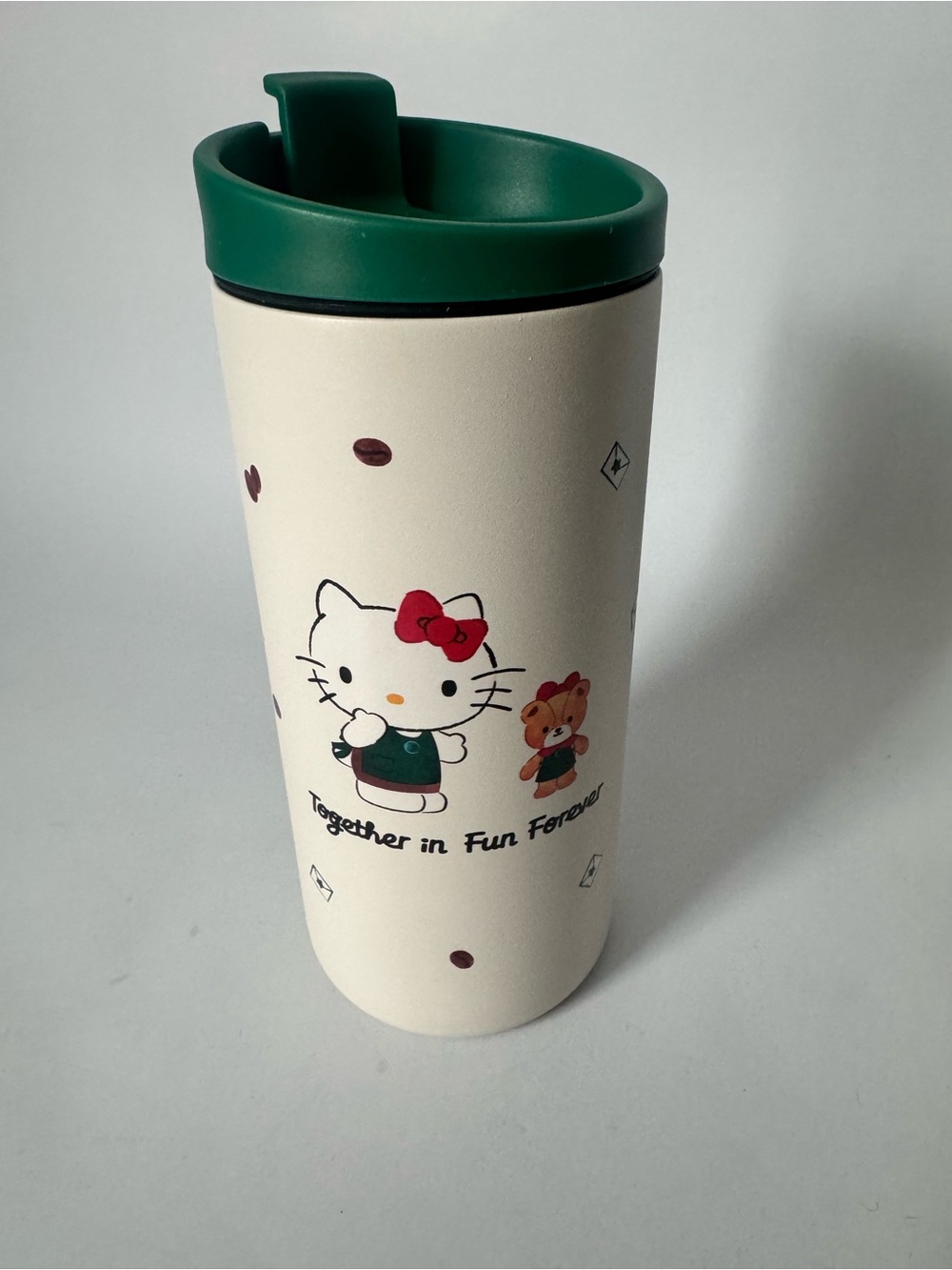 Starbucks Cream Travel Mug with Green Lid and Red Bow Hello Kitty Art